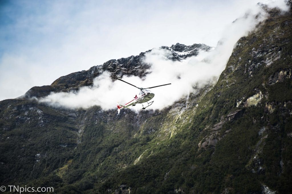 Helicopter flying over the mountains of New Zealand helicopter