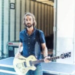 Guitar Player behind the stage