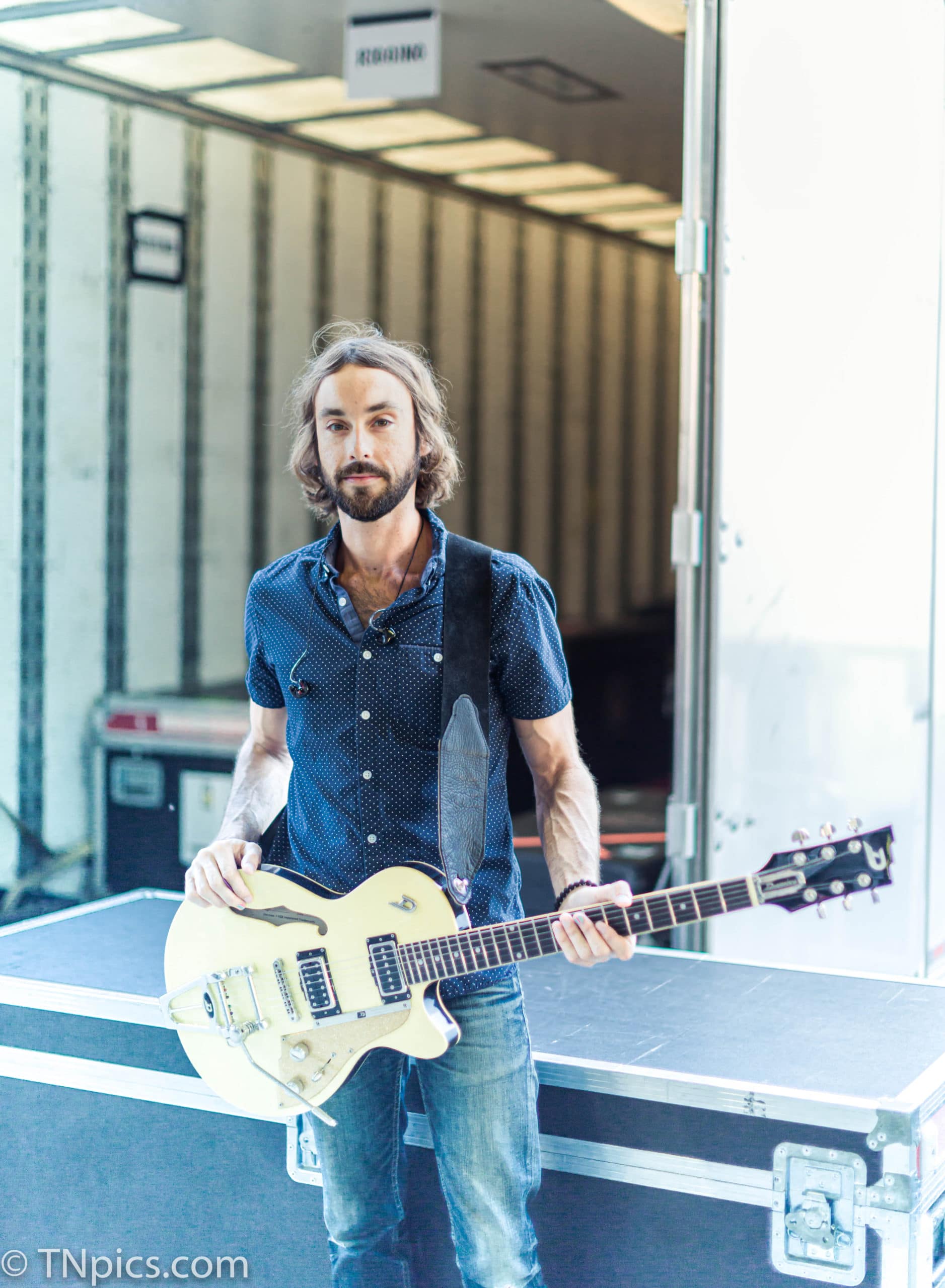 Guitar Player behind the stage