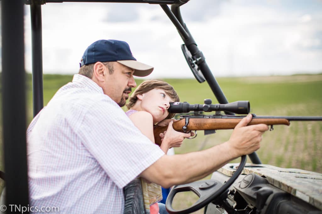 North Dakota girl shooting a rifle the first time with Daddy