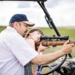 North Dakota girl shooting a rifle the first time with Daddy