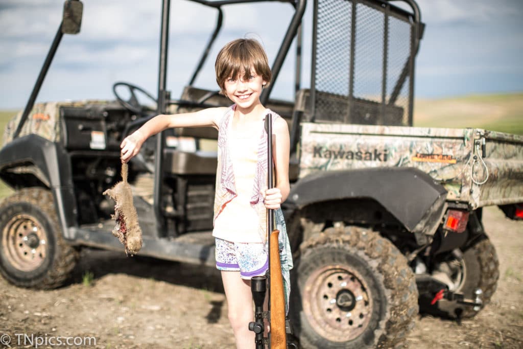 North Dakota girl shooting a rifle the first time