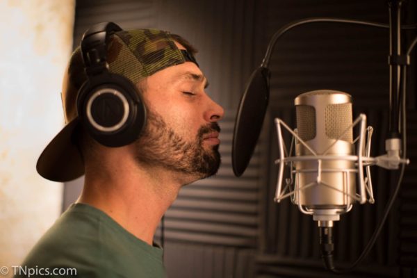 Cale Hoelzman singing in the studio